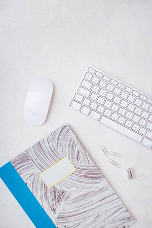 Work desk with laptop and office supplies